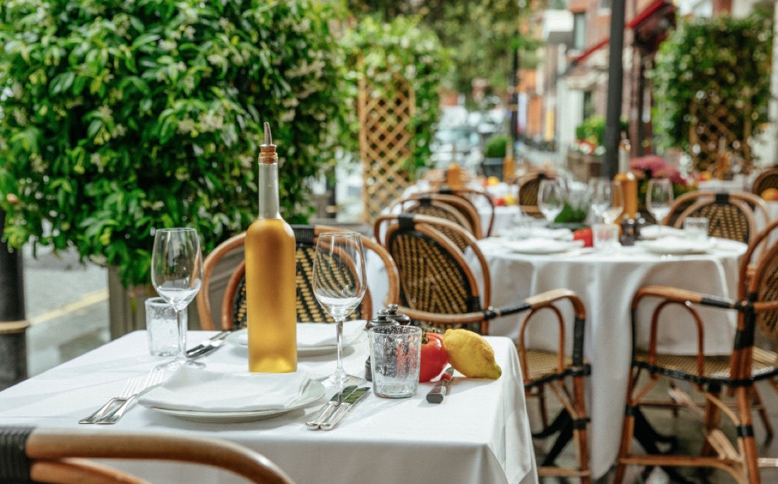 A table set on a leafy terrace